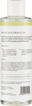 Tył przezroczystej butelki żelu micelarnego z jasnożółtym płynem, widoczne polskie napisy i kod kreskowy.