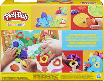 Tył żółtego opakowania Play-Doh Dinozaur z kształtami, dzieci bawią się ciastoliną na macie z dinozaurami.