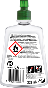 Tył białej butelki Air Wick Active Fresh Automatyczny 228ml z zielonym atomizerem i etykietą ostrzegawczą.