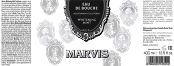Etykieta płynu do płukania ust Marvis Whitening Mint. Centralnie czarna tarcza z nazwą, po bokach opisy i kod EAN.