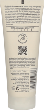 Tył beżowej tubki Goldwell Stylesign Texture Shaping Cream, z widocznym składem, kodem QR i wegańską formułą.