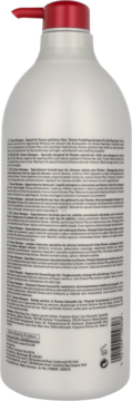 Tył szamponu Goldwell Elumen do włosów farbowanych, duża biała butelka z czerwoną pompką i etykietą.