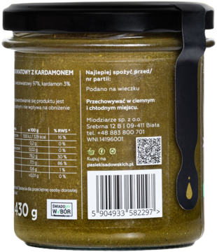 Miód z kardamonem w szklanym słoiku, widok z tyłu. Zielonkawa zawartość, etykieta z danymi odżywczymi.