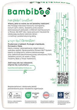 Tylna strona białego opakowania Bambiboo pieluchomajtek z bambusem, zielone grafiki, widoczne certyfikaty.