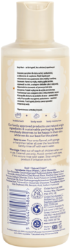 Tył beżowej butelki Childs Farm Oat Derma żelu do ciała z owsem, widoczne szczegóły produktu i składniki.