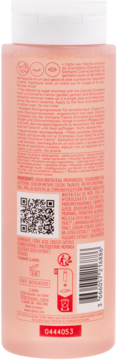 Tył różowej butelki Clarins Cleansing Micellar Water dla cery wrażliwej, z etykietą i kodem QR.