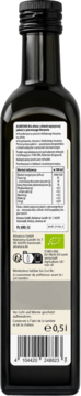 Tył ciemnej butelki oliwy Alnatura extra virgin 0,5l z białą etykietą, danymi żywieniowymi i kodem kreskowym.