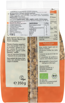 Tył pomarańczowo-beżowego opakowania Alnatura Crunchy Granola Seeds & Seeds z tabelą wartości odżywczych.