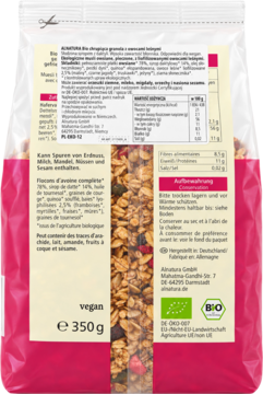 Tył opakowania organicznego musli z płatkami owsianymi, jagodami i datami, widoczne informacje odżywcze.