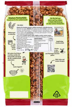 Tył przezroczystego opakowania Crunchy Alnatura z płatków owsianych, czekolady i kokosa. Zielone tło z tekstem i QR kodem.