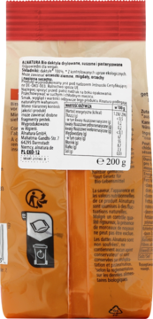 Tył pomarańczowego opakowania daktyli Alnatura, z widoczną tabelą wartości odżywczych i opisem produktu w języku polskim.