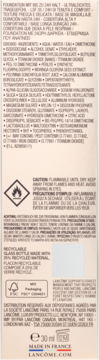 Tył podkładu Lancôme Teint Idole Ultra Wear. Widoczne składniki, ostrzeżenia i symbole recyklingu.