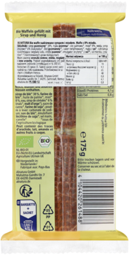 Tył żółtego opakowania organicznych wafli z miodem. Widoczne brązowe, prążkowane wafle i wartości odżywcze.