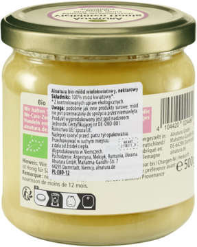 Tył słoika miodu organicznego Alnatura, kremowego, wielokwiatowego, z biało-zieloną etykietą i tekstem.