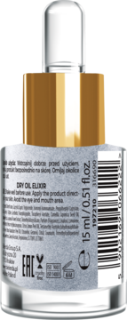 Tył szklanej butelki Dry Oil Elixir z srebrną etykietą, złotym korkiem, widoczne instrukcje i kod kreskowy.
