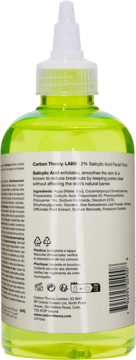 Tył zielonej butelki Carbon Theory 2% Salicylic Acid Facial Tonic, widoczna etykieta ze składnikami.