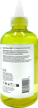 Tył butelki toniku Carbon Theory LABS 2% Salicylic Acid Facial Tonic, przezroczysta, limonkowo-zielona, z etykietą.