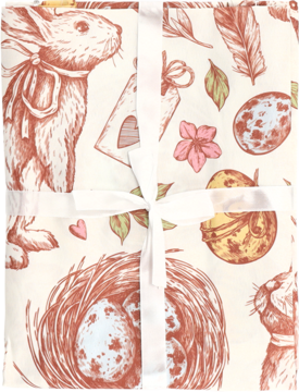 Złożona tkanina z wielkanocnym wzorem: zające, pisanki, pióra, kwiaty, przewiązana białą wstążką.