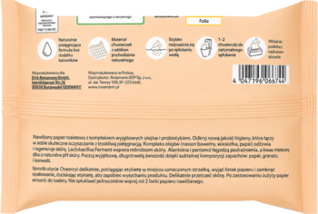 Tył jasnopomarańczowego opakowania nawilżanego papieru toaletowego Rossmann z olejami, probiotykiem i zapachem papai, granatu, konwalii.