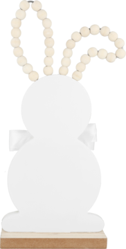 Biała dekoracja królika z uszami z drewnianych koralików i białą kokardą, stojąca na drewnianej podstawie. Widok z przodu.