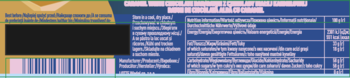 Tył opakowania produktu spożywczego. Górna część żółta, dół niebieski. Widać tabelę odżywczą, listę składników, kod kreskowy.