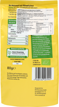 Tył żółtego opakowania Bio Maissnack z Müsli i owocami. Widoczne wartości odżywcze, oznaczenia wegańskie, błonnik.