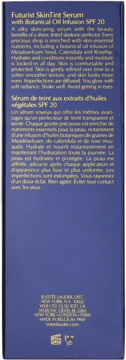 Tył opakowania serum Estee Lauder Futurist SkinTint SPF 20, ciemnoniebieskie tło, złoty tekst z opisem.