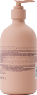 Tył brzoskwiniowej butelki z pompką, z widocznym opisem komfortowego żelu pod prysznic.