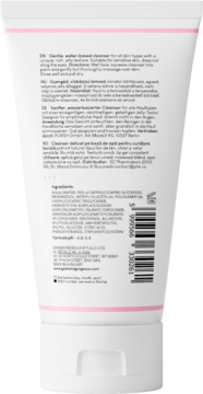 Tył białej tubki delikatnego żelu do mycia twarzy z różowymi paskami. Widoczna lista składników.