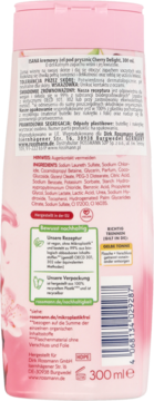 Tył różowej butelki żelu pod prysznic Isana Cherry Delight 300 ml, z czytelną listą składników i informacjami.