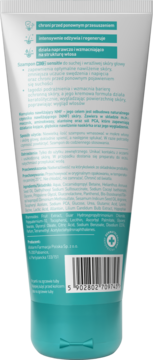 Tył białej tubki szamponu do suchej, wrażliwej skóry głowy, z turkusowym dołem, widoczna lista składników.