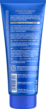 Tył niebieskiej tuby odżywki nawilżającej Hair in Balance Volume 200ml, widoczny opis produktu i kod kreskowy.