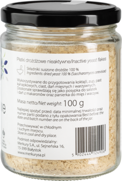 Tył szklanego słoika płatków drożdżowych nieaktywnych 100g. Etykieta produktu z nazwą, składem i wagą netto.