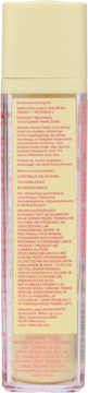 Tył przezroczystej butelki kosmetyku z żółtą zakrętką, widoczna żółta etykieta z czerwonym tekstem produktu.