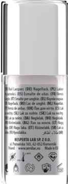 Tył butelki lakieru do paznokci Semilac, z etykietą zawierającą wielojęzyczny opis i ikony ostrzegawcze.