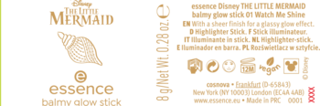 Essence Disney The Little Mermaid rozświetlacz w sztyfcie Watch Me Shine, złote napisy i muszla na czarnym tle.