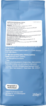 Tył jasnoniebieskiej torebki kawy mielonej bezkofeinowej 100% Arabica, z etykietą i informacjami.