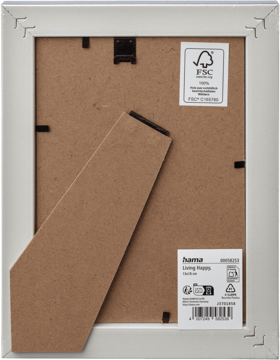 Tył białej ramki na zdjęcia Hama Living 13x18 cm z brązową podpórką i etykietami FSC.