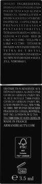 Tył błyszczyka Giorgio Armani Prisma Glass, 3.5 ml, czarne opakowanie z białym tekstem, lista składników.