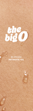 The Big O bi-phase intimate oil. Close-up of light skin with glistening oil droplets for intimacy.