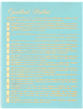 Opulent Dubai, tył jasnoniebieskiego opakowania z listą składników (Shea Butter, Coconut Oil) i multi-języcznymi instrukcjami.