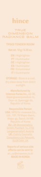 Tylna beżowa etykieta z niskokontrastowym tekstem, zawierająca dane hince TRUE DIMENSION RADIANCE BALM, odczytane jako rozświetlacz.