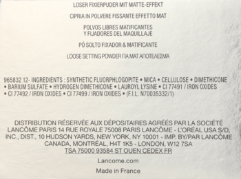 Tył opakowania matującego pudru Lancôme Long Time No Shine, ze szczegółową listą składników i producenta.