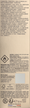 Tył beżowego opakowania podkładu Lancôme Teint Idole Ultra Wear z listą składników.