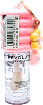 Revolution Lip Oil Lychee Clear w przezroczystej butelce z różowym, deserowym topem i zawieszką, widok z przodu.