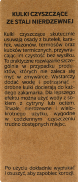 Etykieta produktu Ewa Schmitt HOME: Kulki czyszczące ze stali nierdzewnej, tekst na brązowym tle, instrukcja użycia.