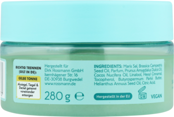 Tył słoiczka peelingu Isana z zielonego szkła, miętowa pokrywka. Widoczna lista składników, waga 280g, info o weganizmie.