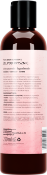 Tył ciemnobrązowej butelki żelu pod prysznic Naturalia Sensitive, różowa etykieta z opisem: nawilżanie, łagodzenie.