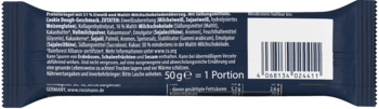 Tył ciemnoniebieskiego opakowania batonika 50g z białymi napisami, kodem kreskowym i informacjami o składzie.