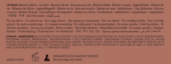 Brązowa etykieta balsamu do ust z białym tekstem, instrukcjami w wielu językach oraz składem.